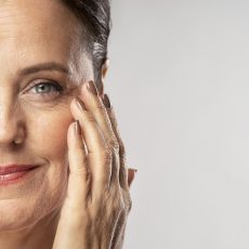 smiley-mature-woman-with-make-up-posing-with-hand-face smiley-mature-woman-with-make-up-posing-with-hand-face